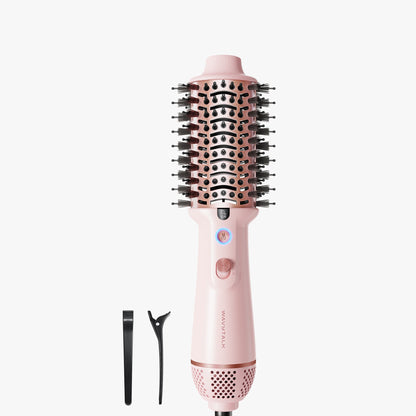 Pink hair styling tool with attachments on a white background