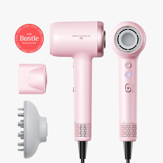 Pink hair dryer with attachments on a white background, featuring Bustle Beauty Award badge.